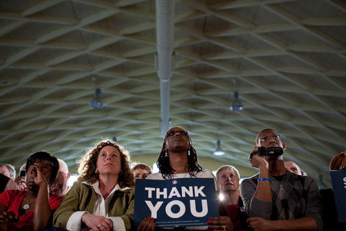 A member of the audience holds a "Thank You" sign during President Barack Obama's speech on medicare fraud and health care insurance reform at St. Charles High School in St. Charles, Mo., March 10, 2010. (Photo credit: Wikipedia)