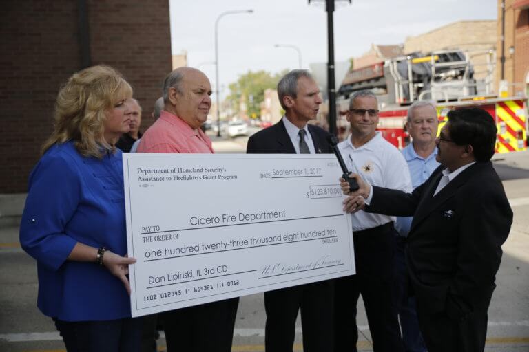 Congressman Dan Lipinski presents the Cicero Fire Department a check for $123,810 received through the Department of Homeland Security's Assistance to Firefighters Grant Program. The grant will help purchase 2,600 combination carbon monoxide and smoke detectors. Photo courtesy of the Town of Cicero