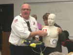 Lt. Bill Leddin instructs CERT trainees on how to properly use an Automated External Defibrillator (AED) to make it possible to respond to a medical emergency where defibrillation is required. Photo courtesy of the Orland Fire Protection District