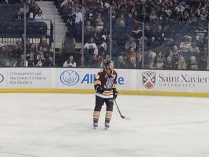 Wolves Hockey player #18 TJ Tynan from Orland Park on the ice at the Allstate Arena. Photo courtesy of Ray Hanania.
