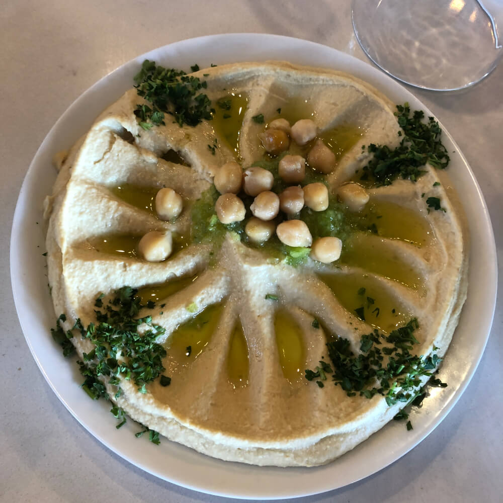 Oozi Hummus dish with garbanzo beans, oil and parsley