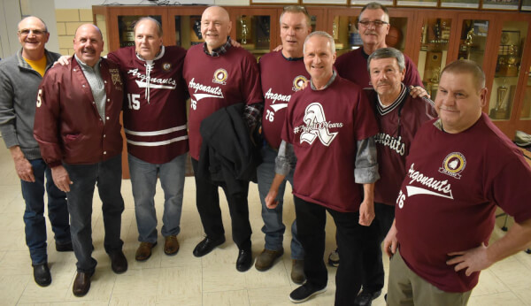 Members of the 1976 state runner-up hockey team gathered for a banner raising Friday night during a centennial celebration at Argo Community High School in Summit. (Photo by Steve Metsch)