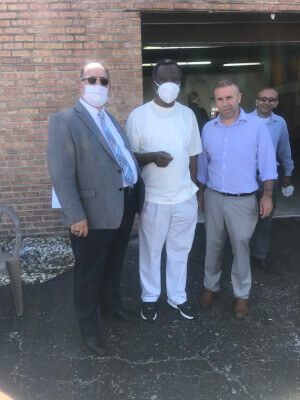 Photo caption: American Arab Chamber President Hassan Nijem, Dr. Willie Wilson, and Palestine Club President Mazen Dola pause during the distribution of the masks.