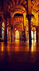 Interior of the Mosque–Cathedral of Córdoba formerly the Great Mosque of Córdoba. The original mosque (742), since much enlarged, was built on the site of the Visigothic Christian 'Saint Vincent basilica' (600).
