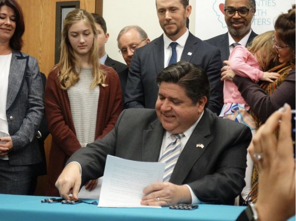 Gov. JB Pritzker signs legislation that caps the out-of-pocket cost of prescription insulin for many people in Illinois during a ceremony Jan. 24, 2020, at the Central Counties Health Centers in Springfield. The law is one of only three that go into effect Jan. 1. (Capitol News Illinois photo by Peter Hancock. Courtesy Des Plaines Valley News)