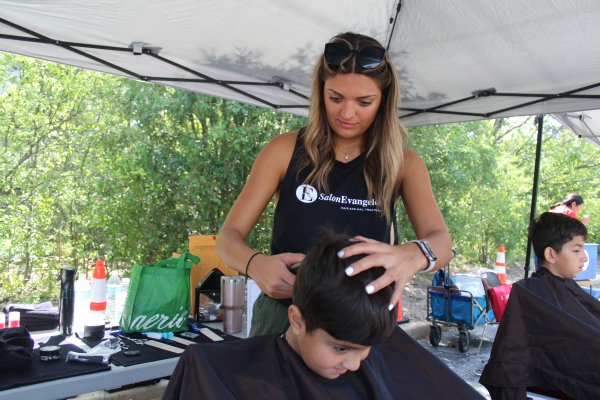 Staff from Salon Evangelos provided haircuts to the children at the Orland Township Back-to-School Health Fair Aug. 14, 2021. Photo courtesy of Steve Neuhaus.
