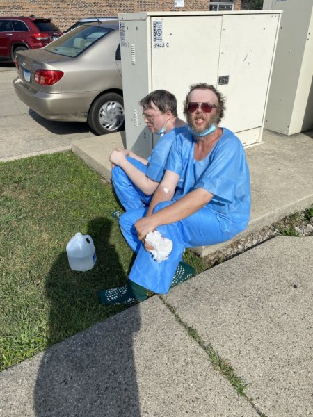 Brothers Michael Lelko, 56, (foreground) and John Lelko, 51, (bacK) told Lyons police that they buried in their back yard their mother, who died when their sister pushed her down some stairs in 2015. They said their sister died in 2019 and they buried her in the backyard of their Lyons home at the 3900 block of Center Avenue. Photo courtesy of Ray Hanaia
