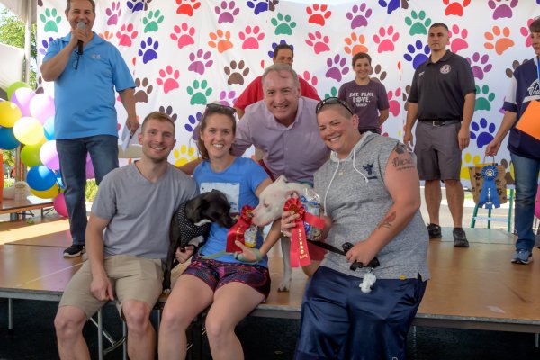 Supervisor Paul O'Grady on stage with pet contest winners at the 8th annual Pet-Palooza in 2019.