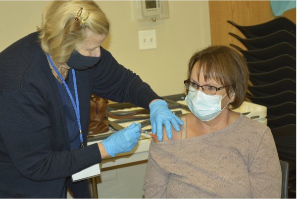 Nurse Pat Hamadeh administering a flu shot during one of the Township clinics.