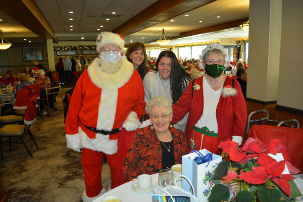 Santa and Mrs. Claus greeted guests including Caryl Tietz at the event