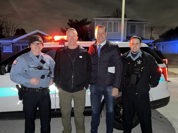 Stephan Alheim and Lyons Mayor Chris Getty and members of the Lyons Police Department. Photo courtesy of the Village of Lyons