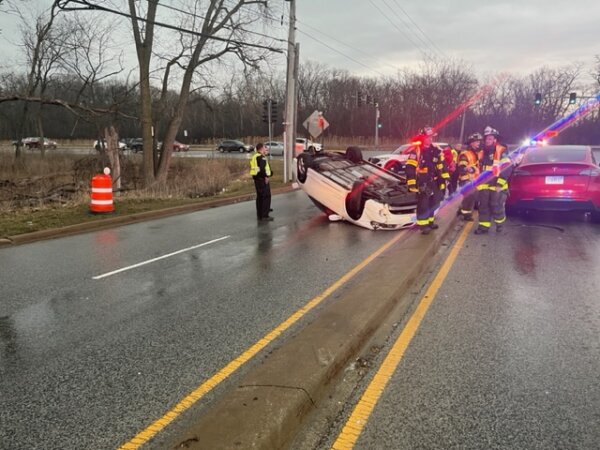 Orland Fire Protection DIstrict firefighter/paramedics treat two individuals for injuries in an accident that resulted in one vehicle being flipped over on its roof at 151st near Harlem Avenue on Sunday March 26, 2023