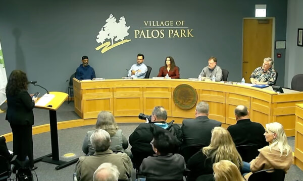 Ronette McCarthy, a candidate for Mayor of Palos Park, addresses the Palos Park Village Board on the issue of expanding Wu's House parking into land adjacent to the huge restaurant on the east.