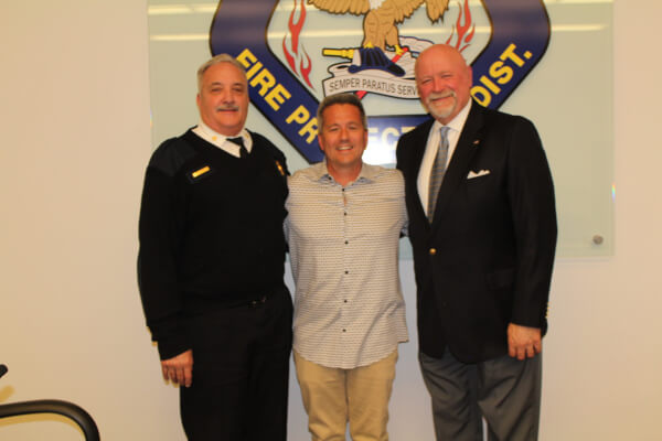 OFPD Fire Chief Michael Schofield, former OFPD Board President Christopher Evoy, and OFPD President John Brudnak