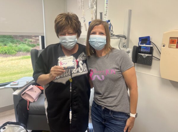 Cancer survivor Joy Harmon (right) visited the Northwestern Medicine Cancer Center in Orland Park on Tuesday, June 13 to deliver care packages to patients receiving treatment. Photo courtesy of Northwestern Medicine Cancer Center