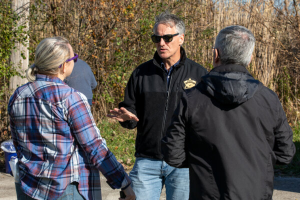 Cook County Sheriff Tom Dart talks with volunteers during a cleanup of the Deer Creek River in Ford Heights Village Friday Nov. 10, 2023. Photo courtesy of Sheriff Tom Dart