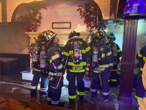 Firefighters inspect the Al Bahaar Restaurant, 39 Orland Square Dr., after extinguishing a fire that was inside the wall of the building and not obviously seen. Photo courtesy of the Orland Fire Protection District