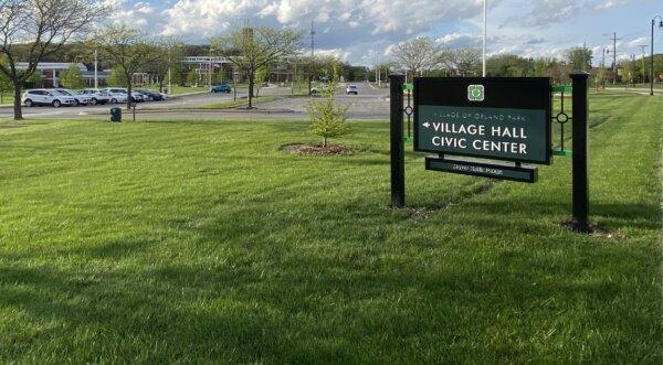 One of two new Orland Park Village signs with Pekau's name on it, at the south parking lot entrance across from Orland Township. Photo courtesy of Ray Hanania