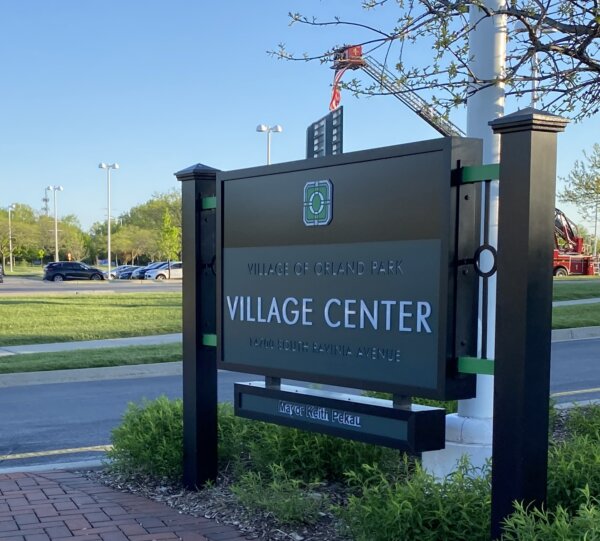 One of two new Orland Park Village signs with Pekau's name on it, at front entrance. Photo courtesy of Ray Hanania