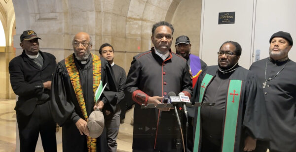 Pastor Ira Acree leads Pastors in calling for property tax reforms in Cook County at a press conference Dec. 15, 2025