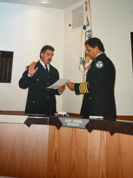Winkelman being sworn in by the Former OFPD Fire Chief Robert Buhs. Photo courtesy of Robert Winkelman