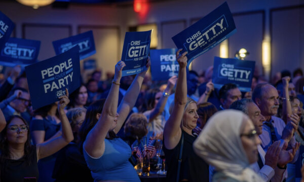 Supporters waved signs that read "Chris Getty for Congress," 4th Congressional District, and "People over Party," the slogan emphasizing that Getty's candidacy isn't about one party but about representing every constituent in the 4th Congressional District.